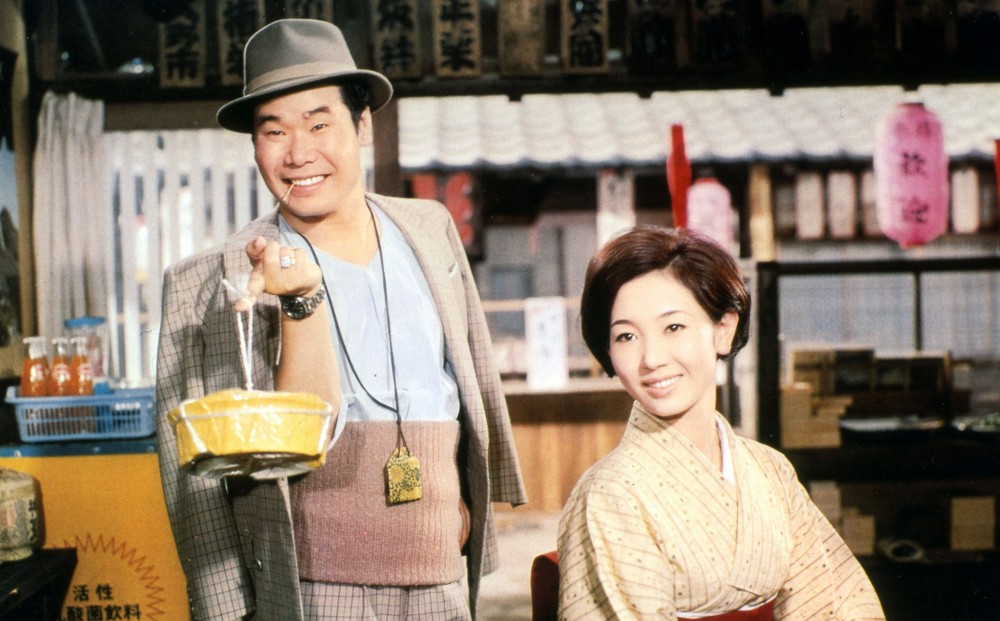 Actors Kiyoshi Atsumi and Chieko Baisho both smile at someone off-camera.
