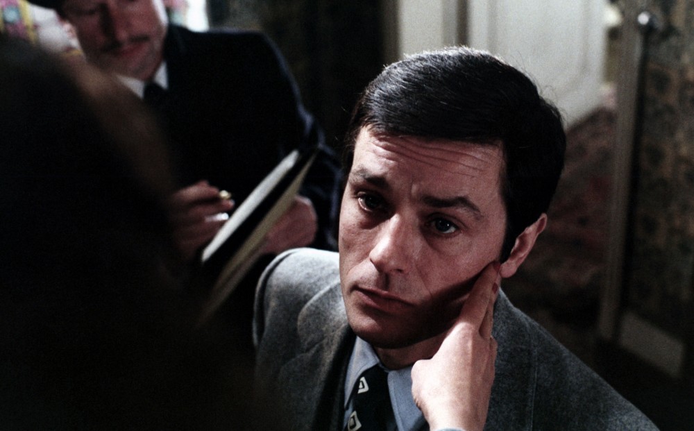 Actor Alain Delon's face from the perspective of the person touching it.