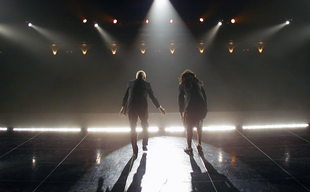 From TAP HEAT - two people tap dance on stage, their backs to the camera.