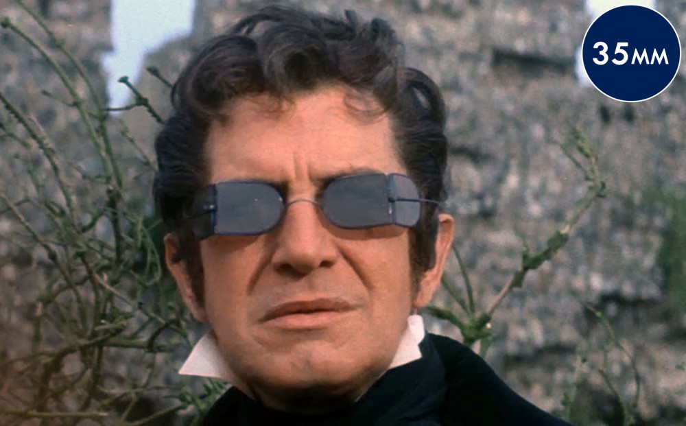 Close-up on actor Vincent Price, wearing dark glasses.