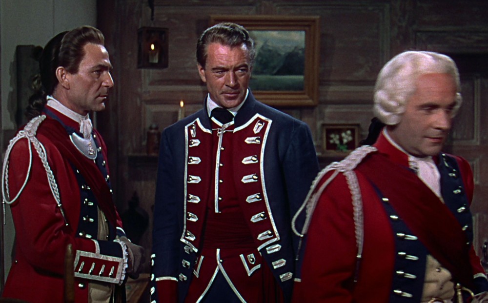 Actor Gary Cooper and two other men stand in colonial military garb.