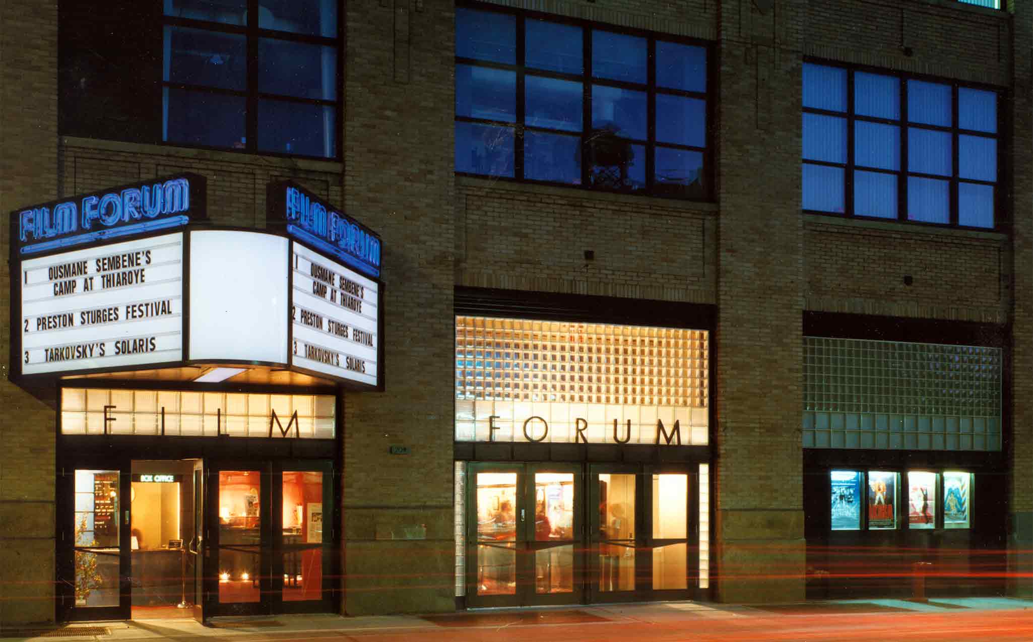 Film Forum's marquee and building, photographed at night