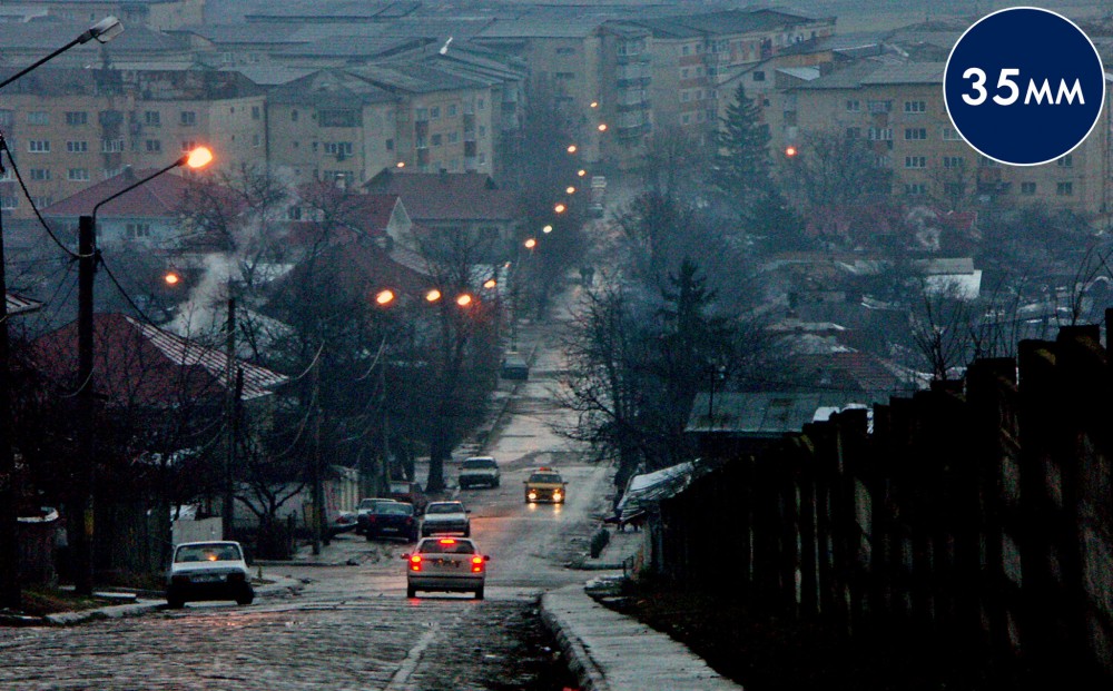 A view of a hilly street at twilight.