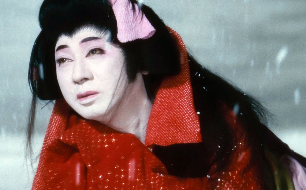 Close-up on actor Kazuo Hasegawa in onnagata (a man playing a woman in kabuki) costume.