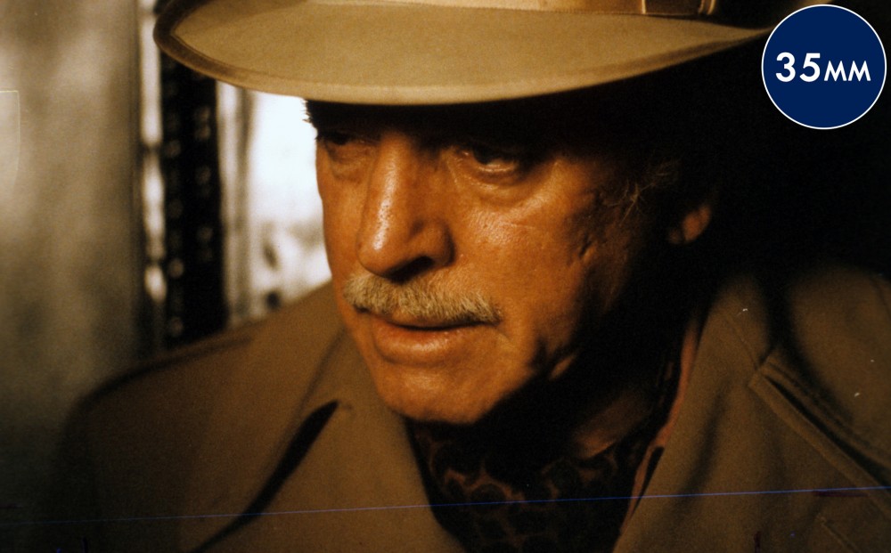 A close-up on actor Burt Lancaster's face.