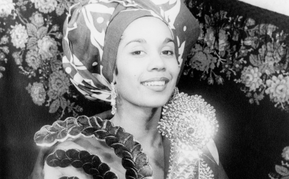 A black-and-white image of young Carmen de Lavallade, smiling.