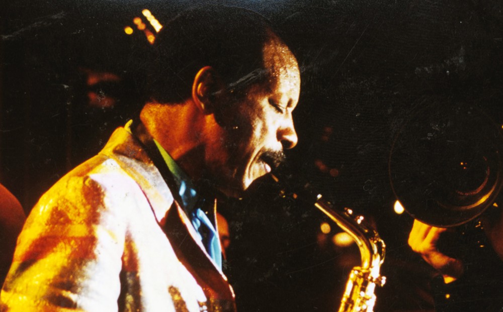 Ornette Coleman plays the saxophone.