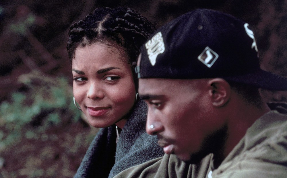 Janet Jackson looks tenderly at Tupac Shakur, whose face is in profile.