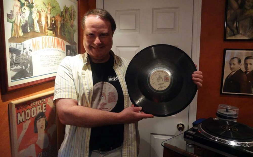 Ron Hutchinson holding a record.