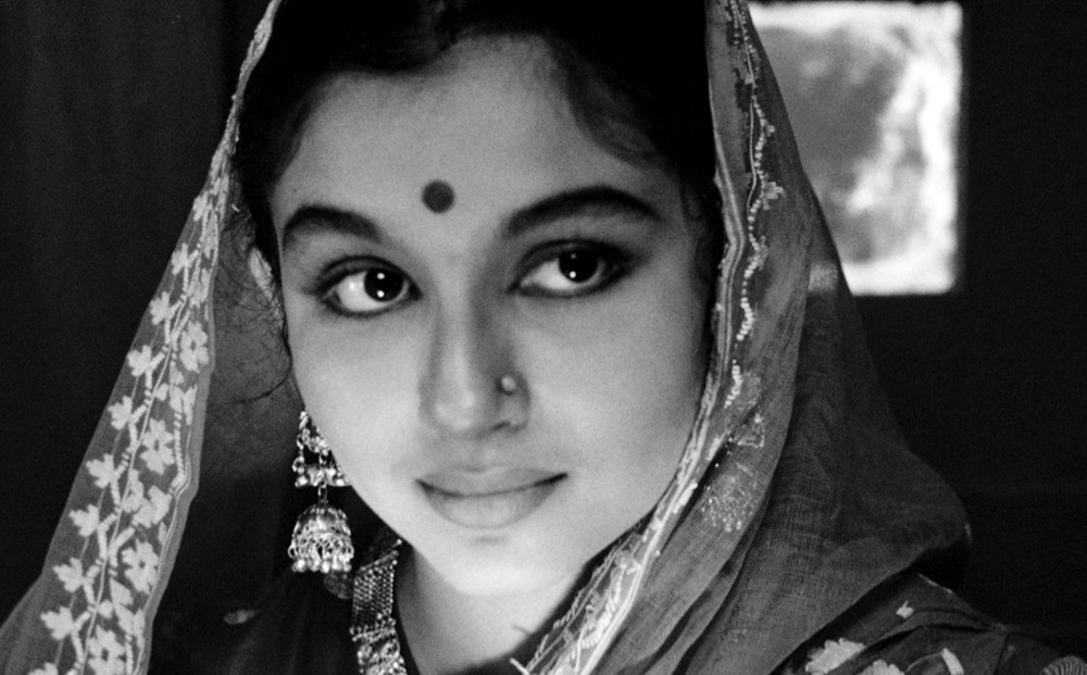 A close-up on actor Sharmila Tagore's face.
