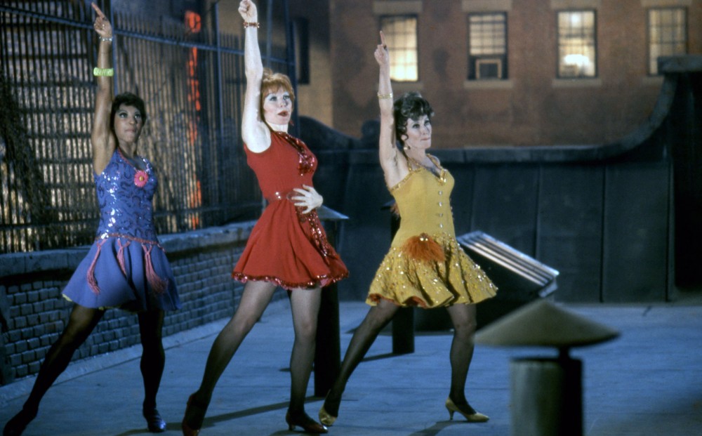 Actors/dancers Shirley MacLaine, Chita Rivera, and Paula Kelly in the middle of a show-stopping dance number.