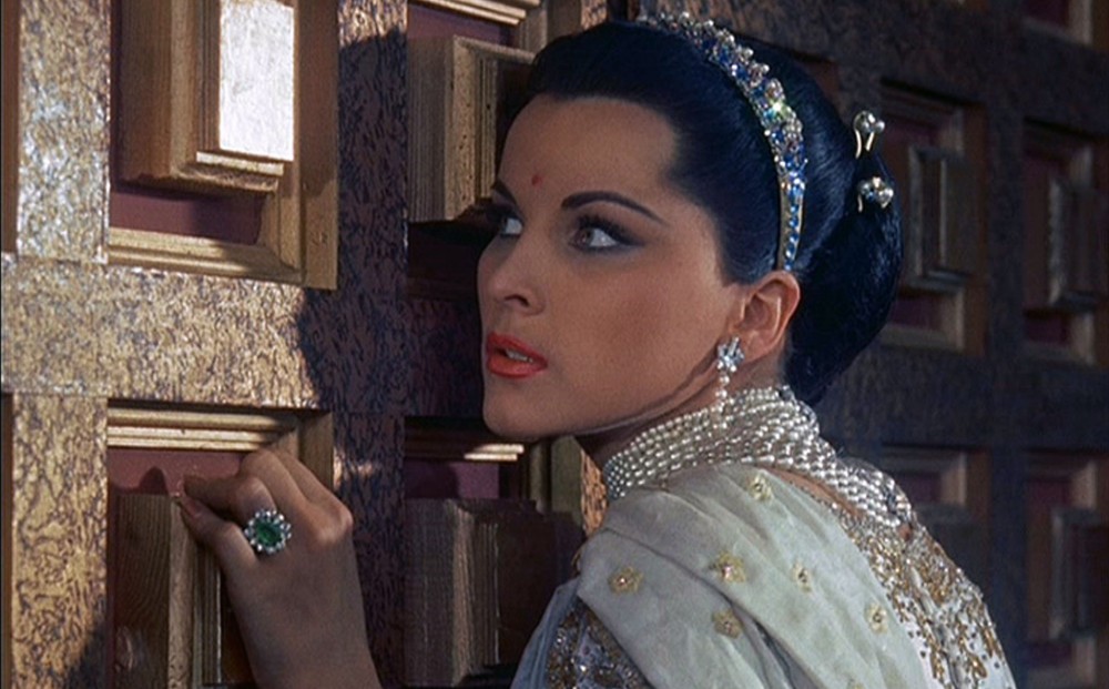 From THE INDIAN TOMB: Actor Debra Paget listens at a door.