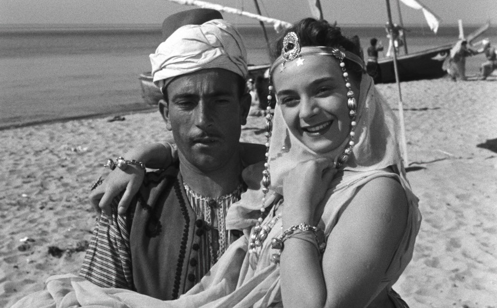 A man and woman dressed in exotic costume.